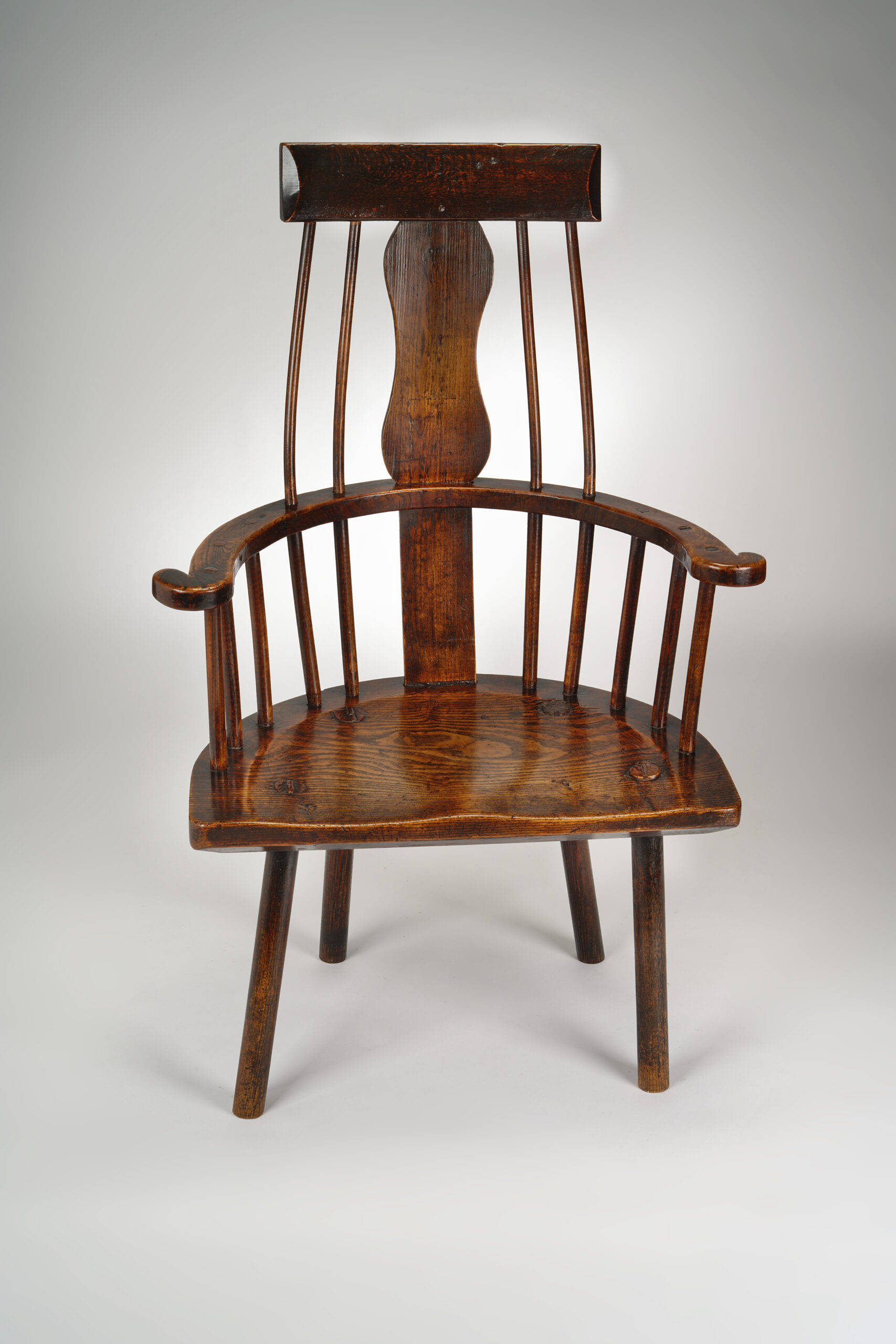 Image of An 18th Century Welsh Primitive Comb-back Windsor Armchair.