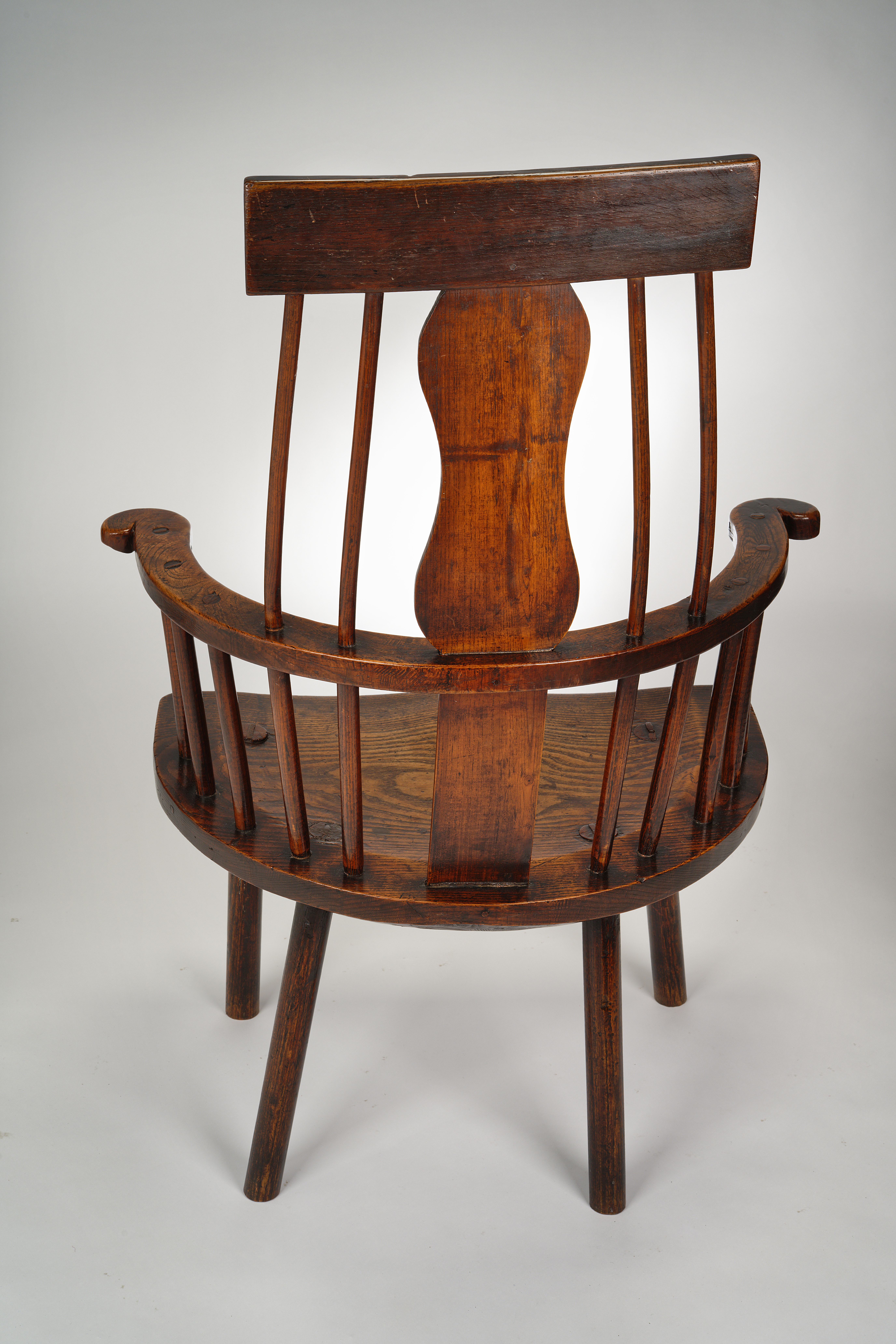 Image of An 18th Century Welsh Primitive Comb-back Windsor Armchair.